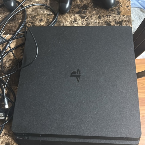 PS4 Slim (1T Storage) with 2 DualShock 4 Controllers - Picture 3 of 9